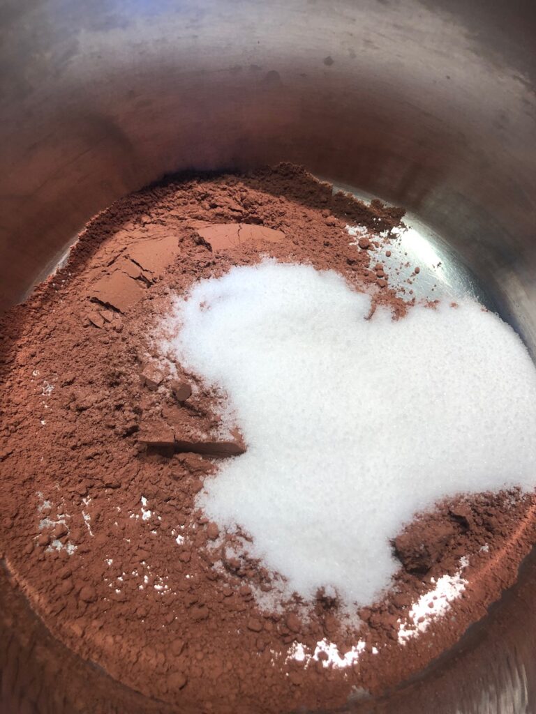 Cacao and Sugar in heavy bottomed saucepan