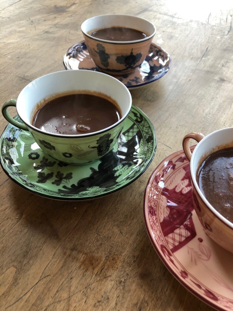 Vegan Hot Chocolate served in a pretty cup on a saucer