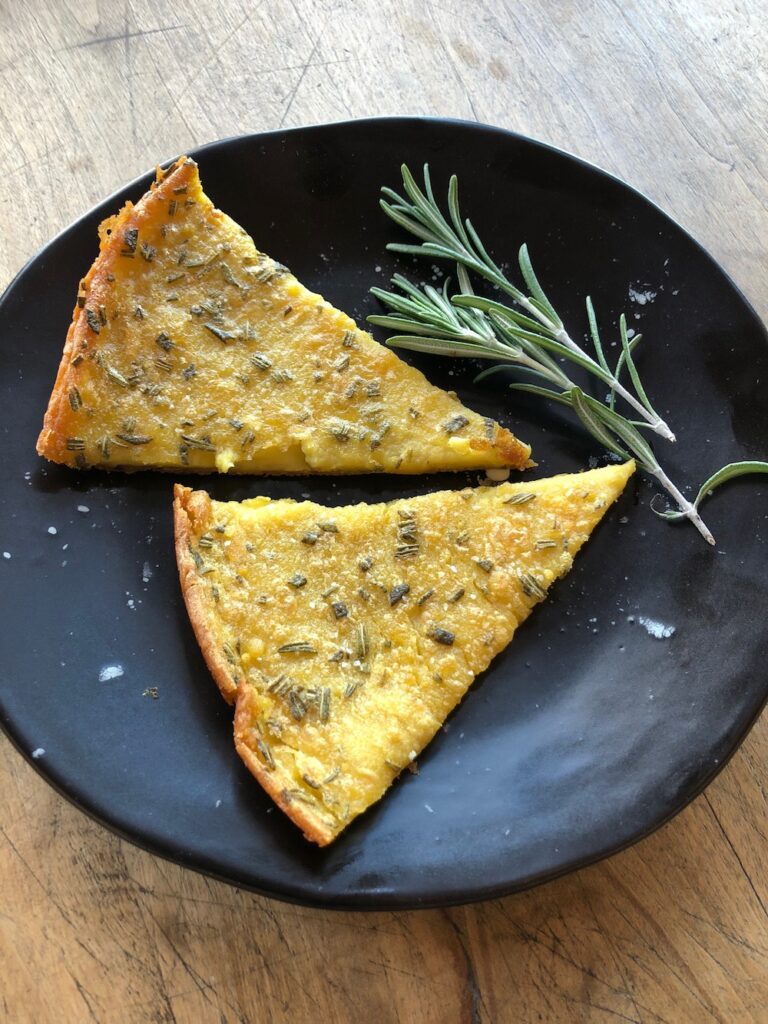 2 wedges of farinata served on a plate.