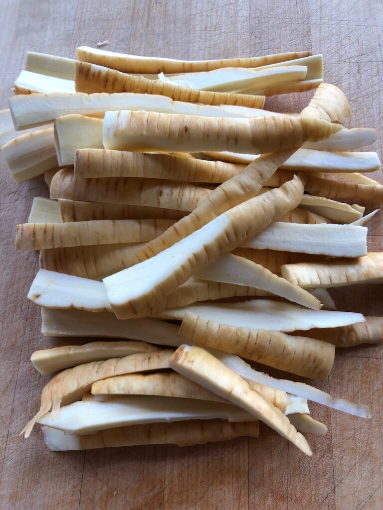 Trimmed and quartered cut parsnips ready to cook