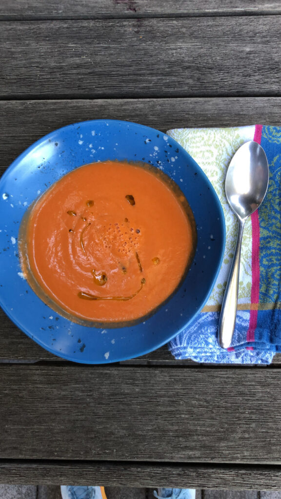 Bowl of Gazpacho Soup Served with a drizzle of Extra Virgin Olive Oil