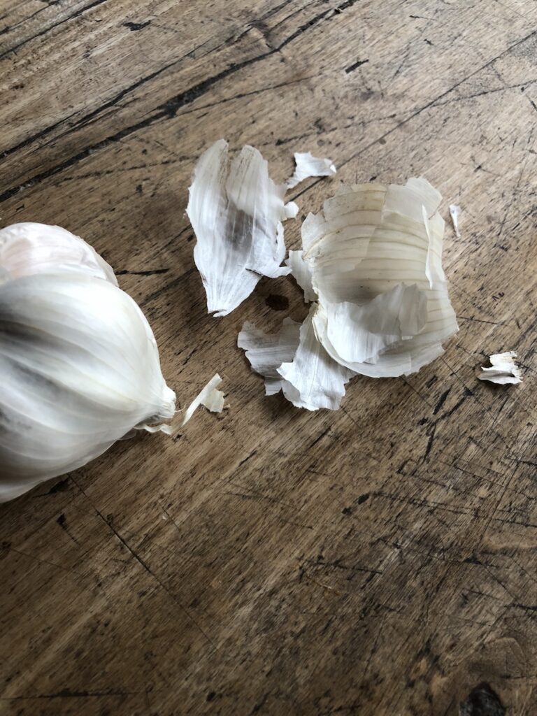 Removing papery skins from Garlic