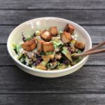 a big bowl of salad with Japanese salad dressing.