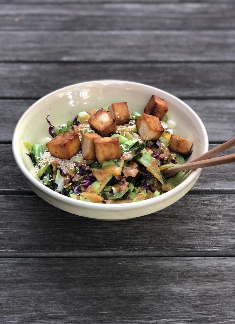 a big bowl of salad with Japanese salad dressing.